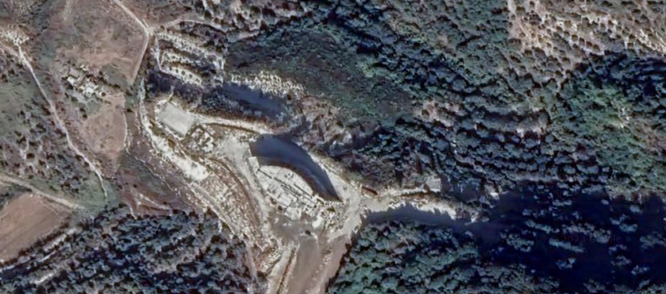 Satellite view of the development site surrounded by woodland